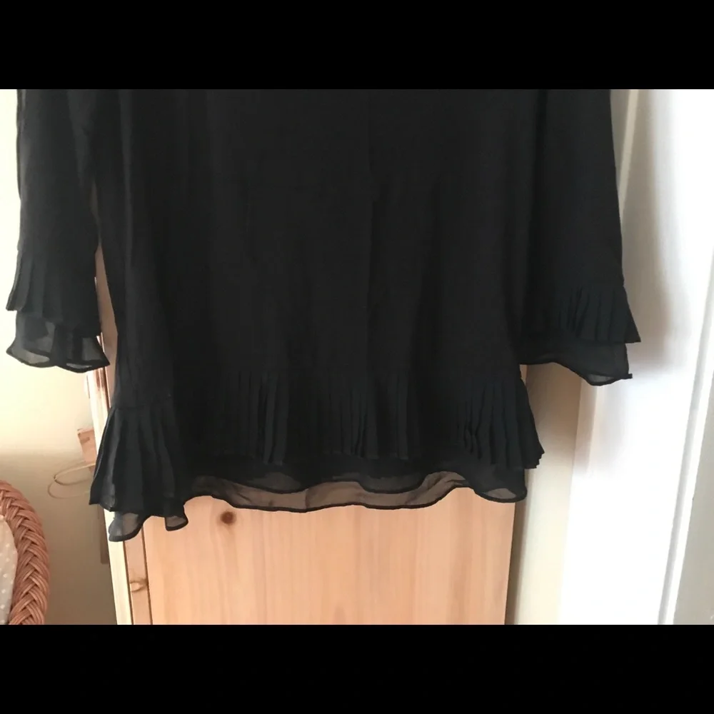 Danielle Rainn Pleaded Ruffle Trim Knit Top