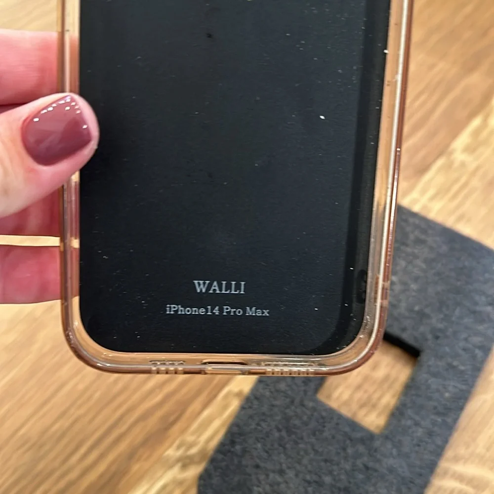 Walli Ohone case! I phone 14 pro max. Has wear but still works great!