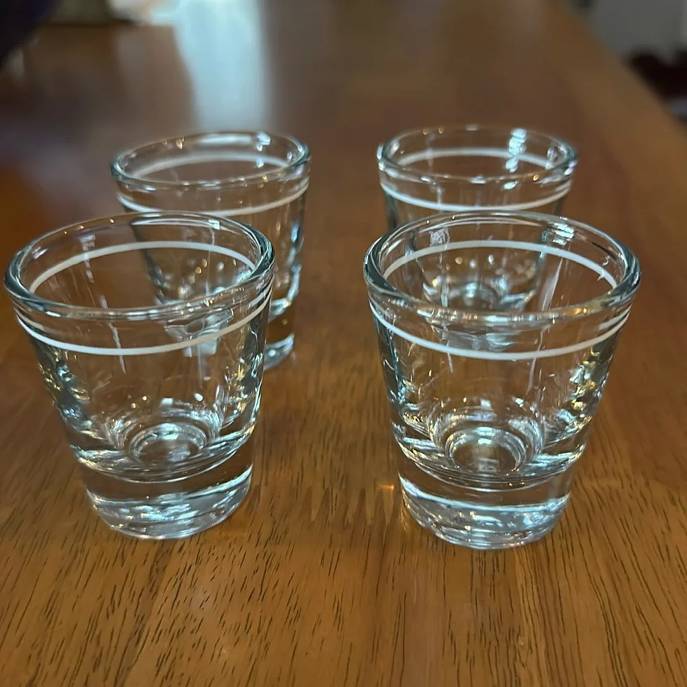 Anchor Hocking shot glasses. Clear with white stripe. Originally from Starbucks