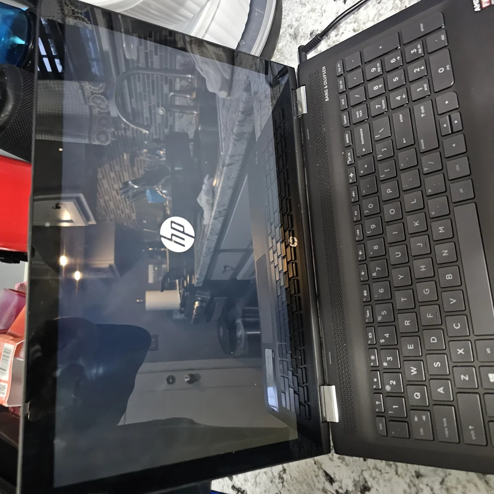 HP Black Laptop with Slim Design and Textured Finish