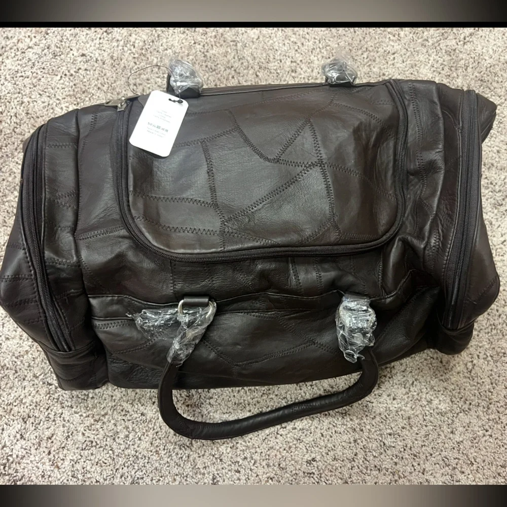 NEW BROWN DUFFLE BAG WITH ACCESSORIES
