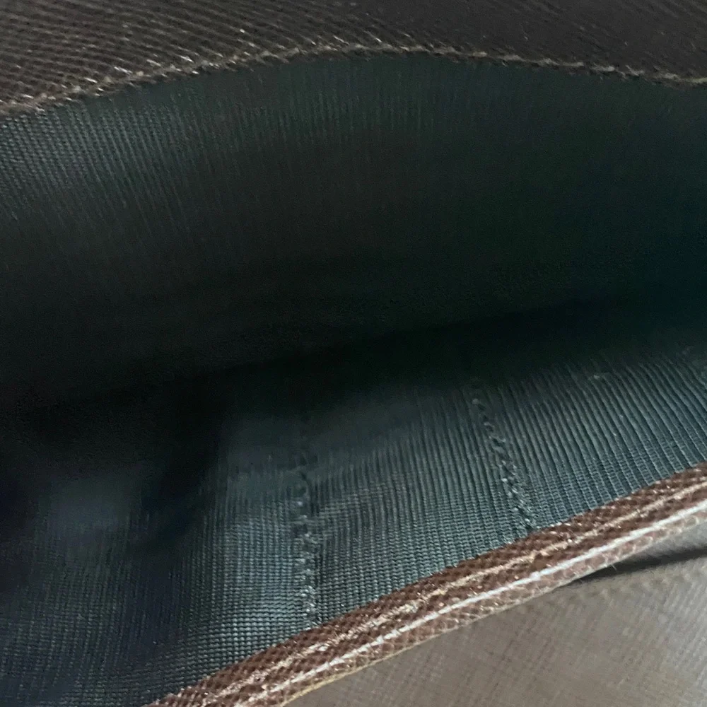 Salvatore Ferragamo Deep brown leather wallet with gold accent