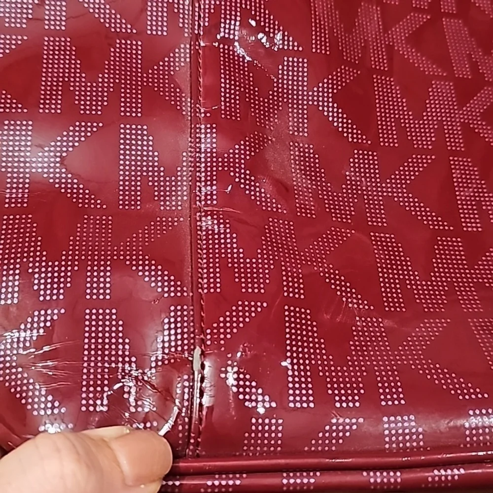 Red michael kors tote purse.
