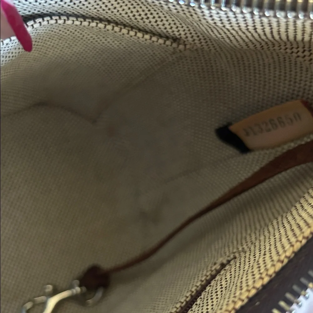 Dooney & Bourke small stain