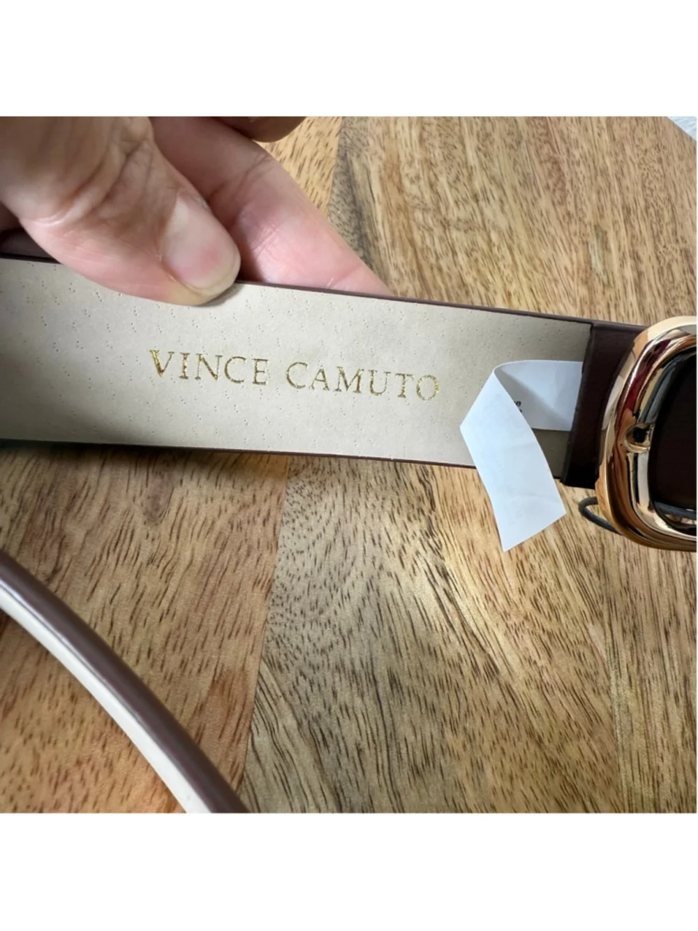 Vince Camuto features by gold