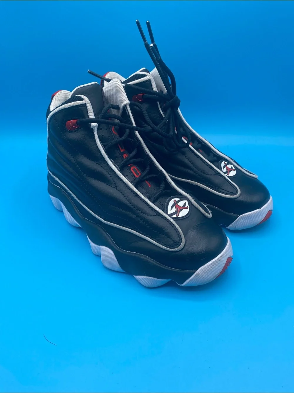 Jordan Pro Strong black, white, and university red