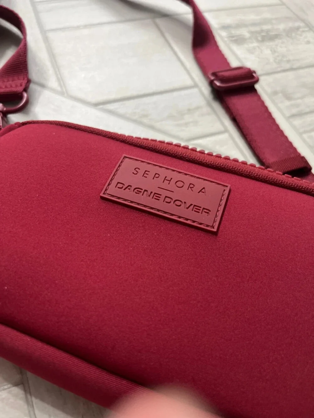 Dagne Dover Sephora colab bag. Burgundy crossbody with long strap brand new cond