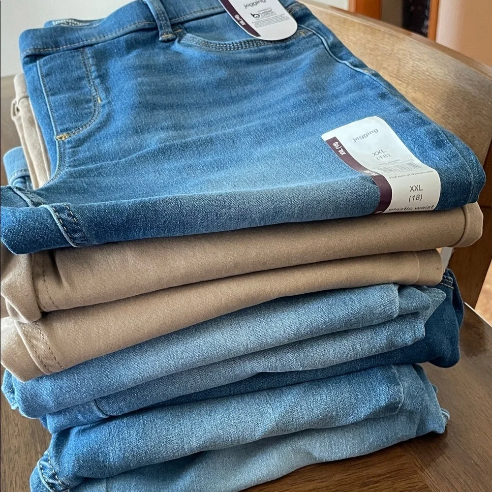 Stack of girls Jeans and Jeggings in Blue and Tan 3 new pair on top