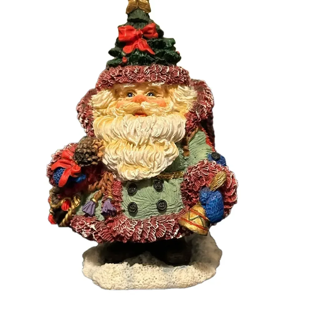 So adorable - mini Santa dressed for traveling! Wears a Christmas tree hat!