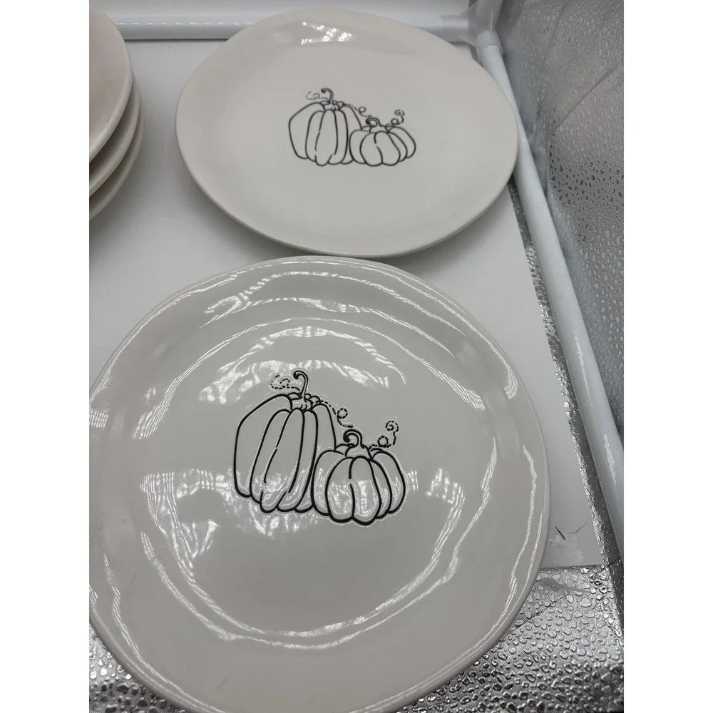 Pier 1 Imports stoneware dessert plates with a black and white pumpkin pattern.