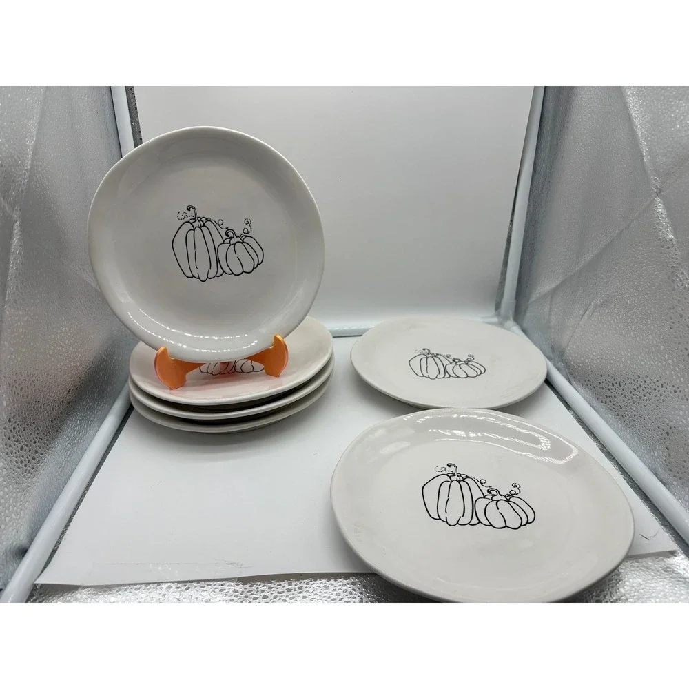 Pier 1 Imports stoneware dessert plates with a black and white pumpkin pattern.