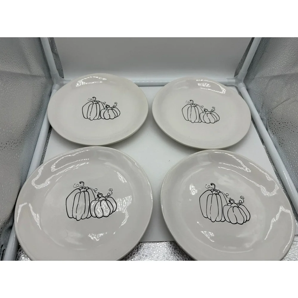 Pier 1 Imports stoneware dessert plates with a black and white pumpkin pattern.