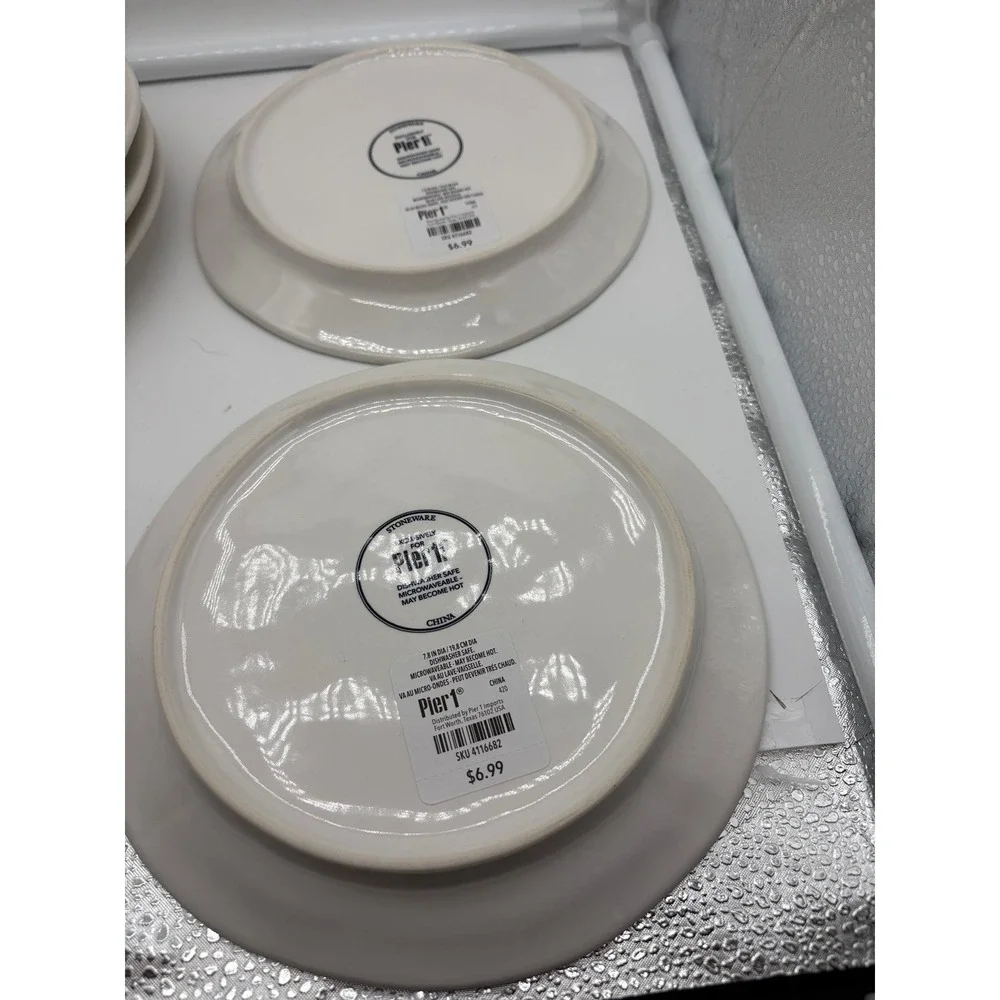 Pier 1 Imports stoneware dessert plates with a black and white pumpkin pattern.