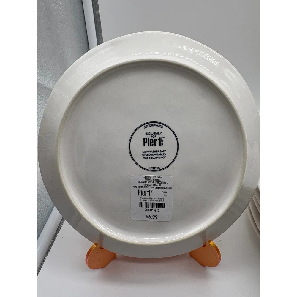 Pier 1 Imports stoneware dessert plates with a black and white pumpkin pattern.