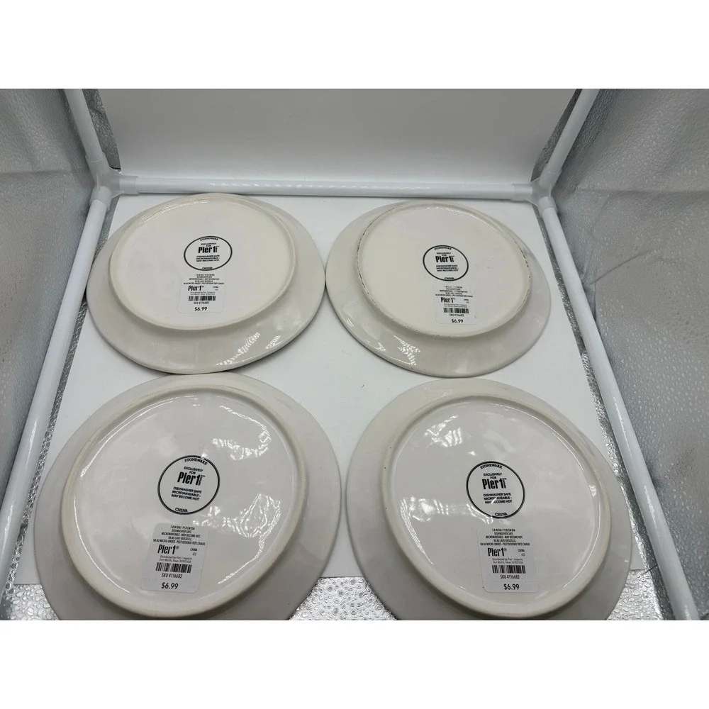 Pier 1 Imports stoneware dessert plates with a black and white pumpkin pattern.