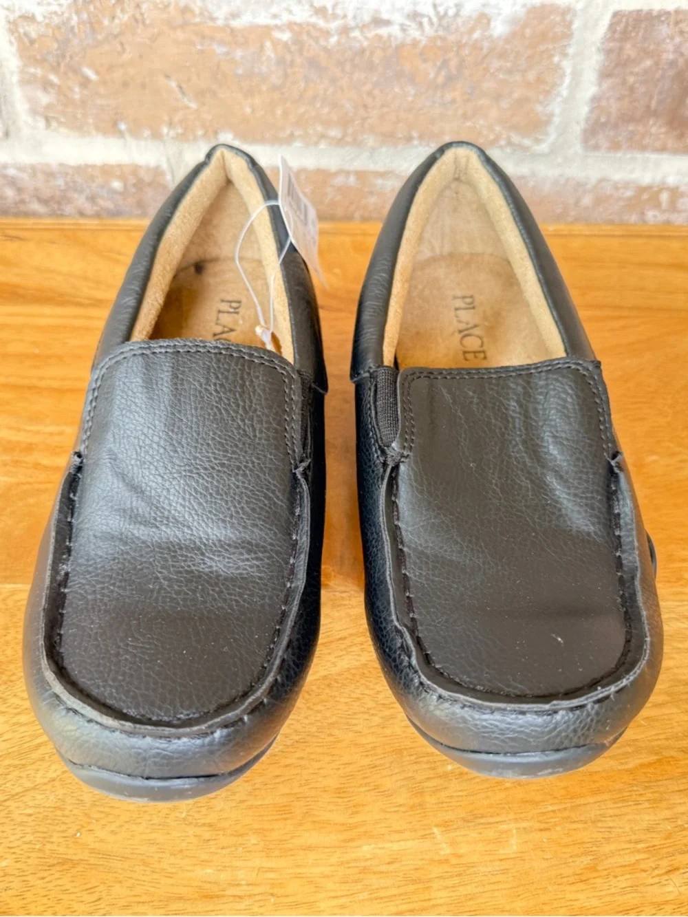 The Children's Place Black Slip-On moccasins.