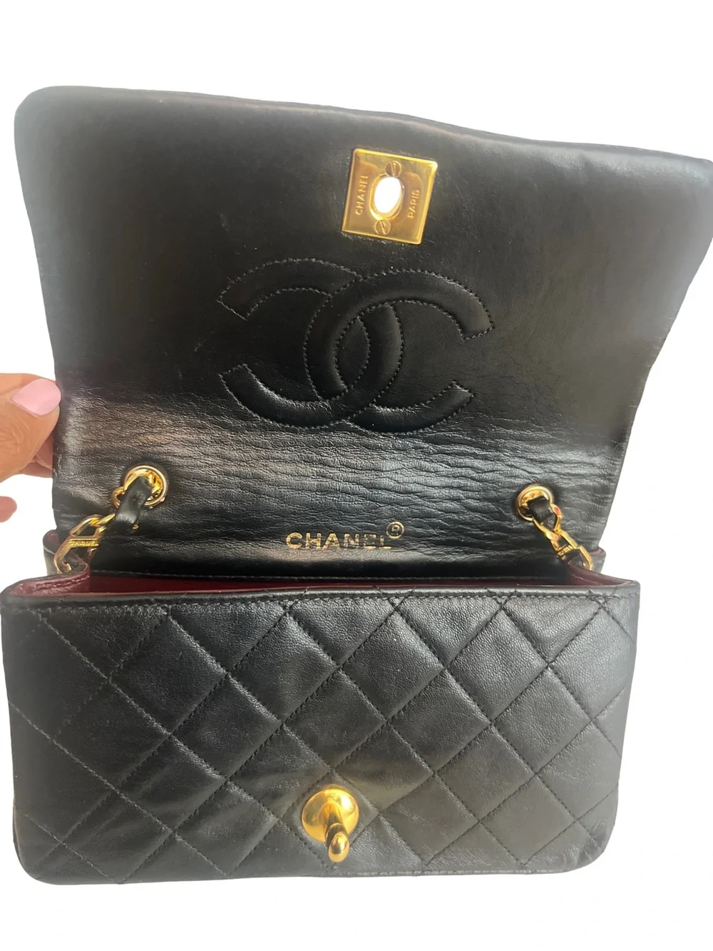 CHANEL Black Quilted Lambskin Mini Flap Bag with Gold Chain