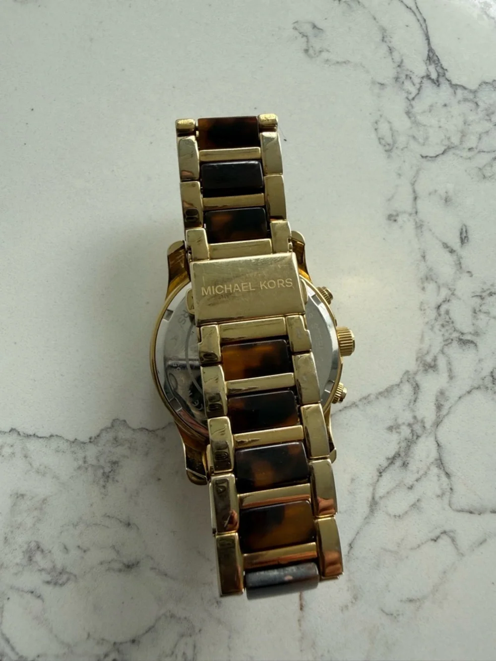 Michael Kors gold tone