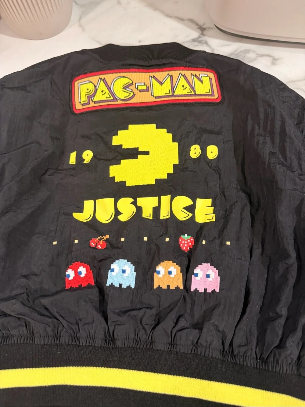 Justice Black Mini Bomber Jacket with Yellow Pac-Man Accents