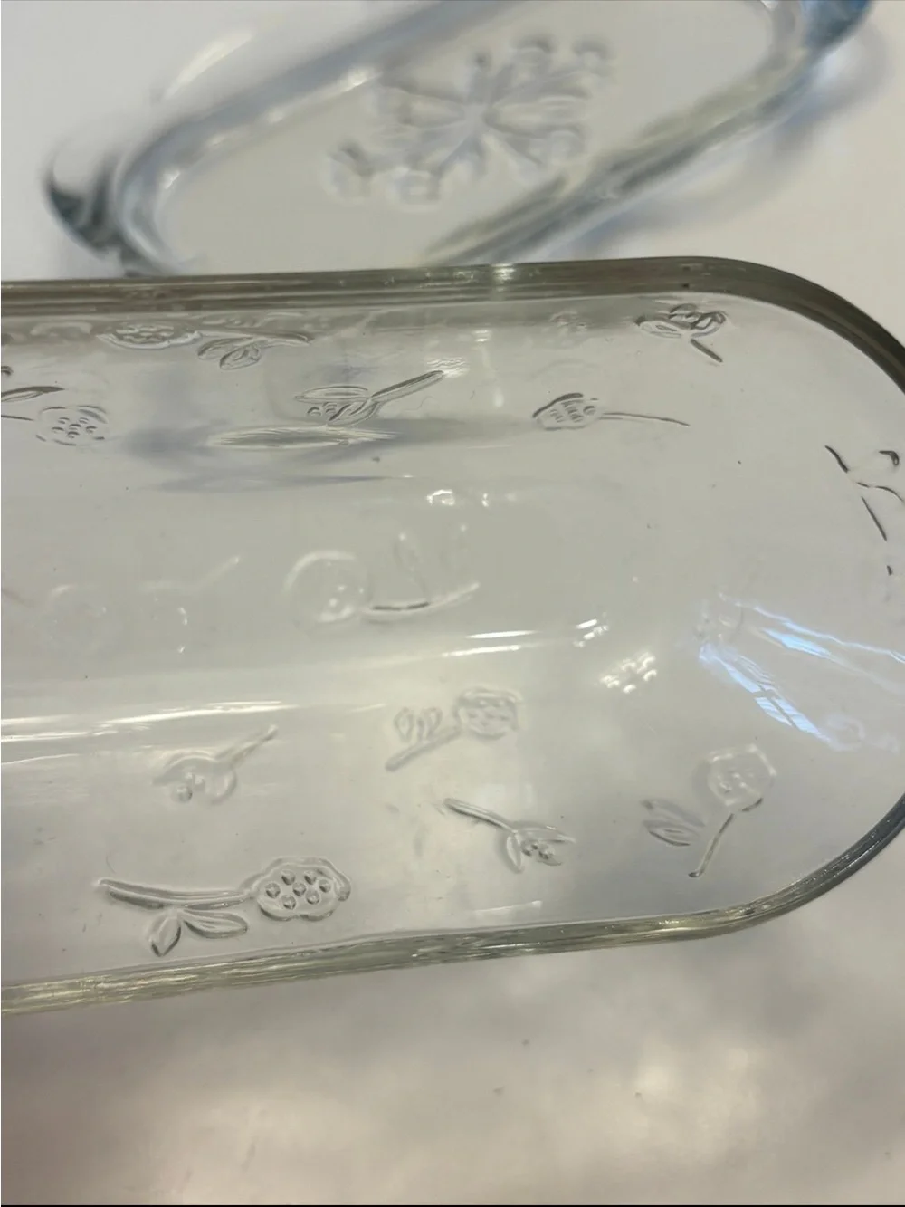 Anchor Hocking Savannah butter dish features a pressed clear glass design flower