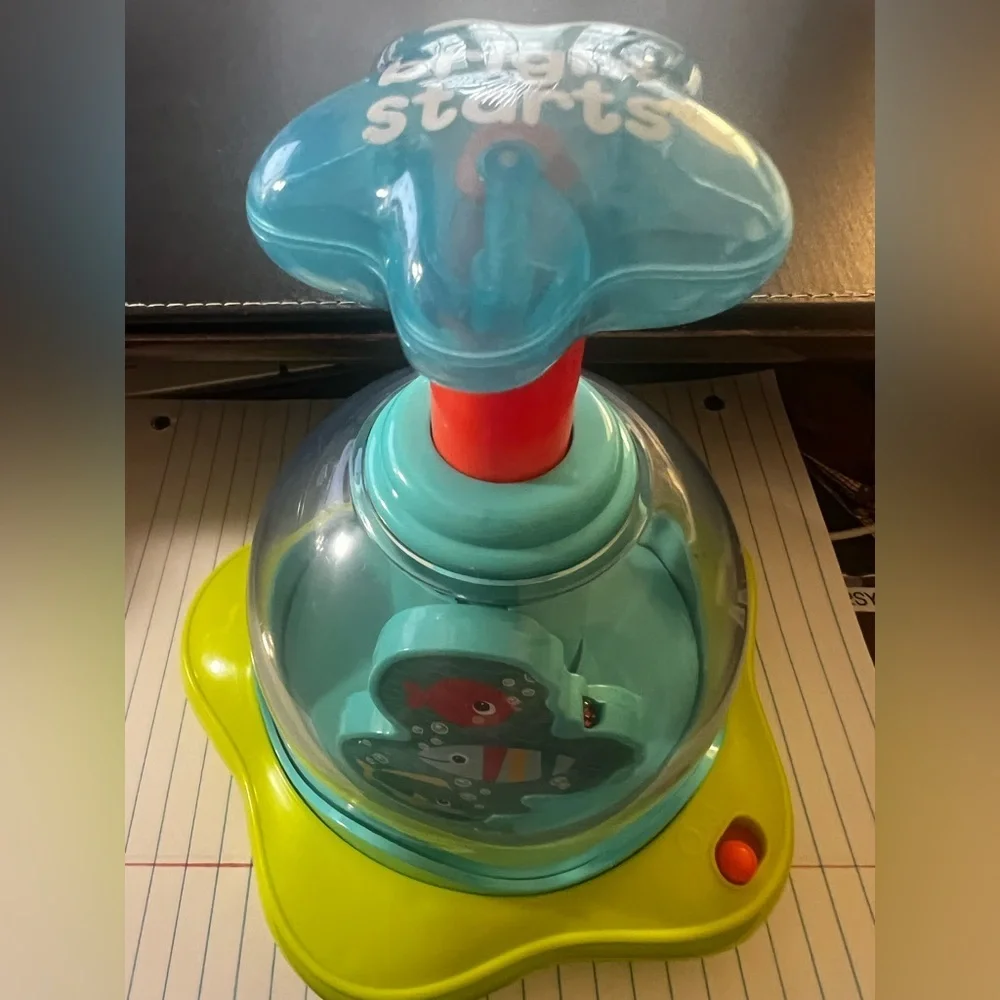 BRIGHT STARS PRESS AND GLOW SPINNER.  EVERY PUSH MAKES THE STARS GLOW