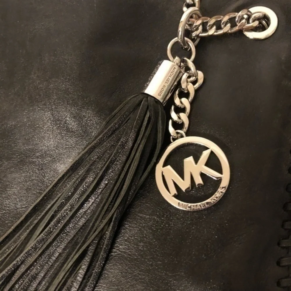 Michael Kors scratches abs surface