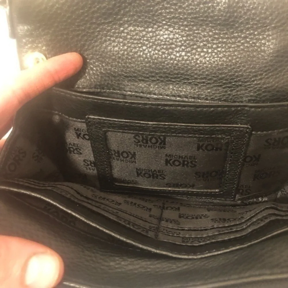 Michael Kors scratches logo