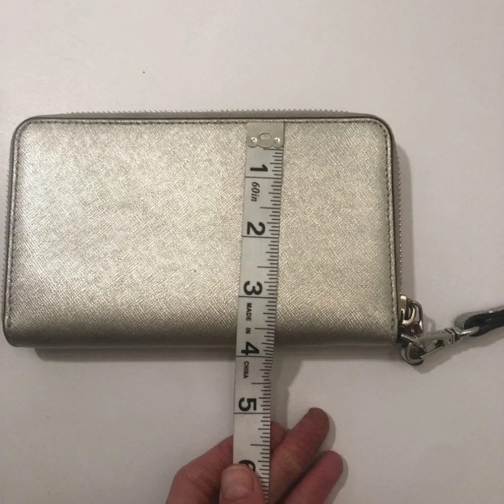 Michael Kors light marks tiny