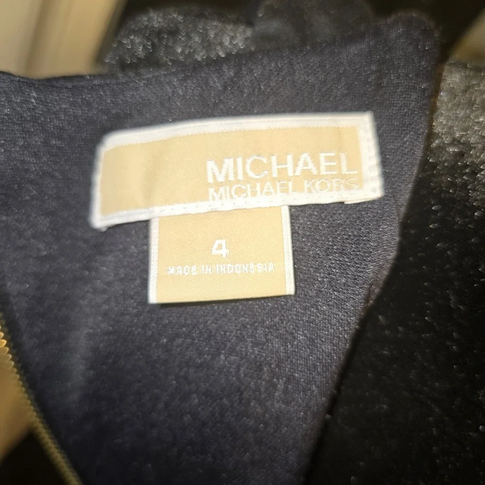 Michael Kors command attention