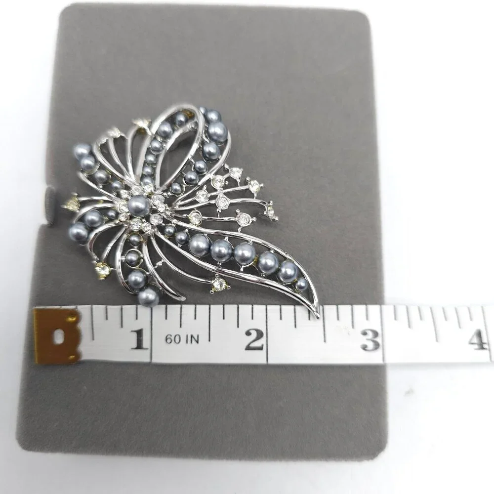 Nolan Miller looking brooch