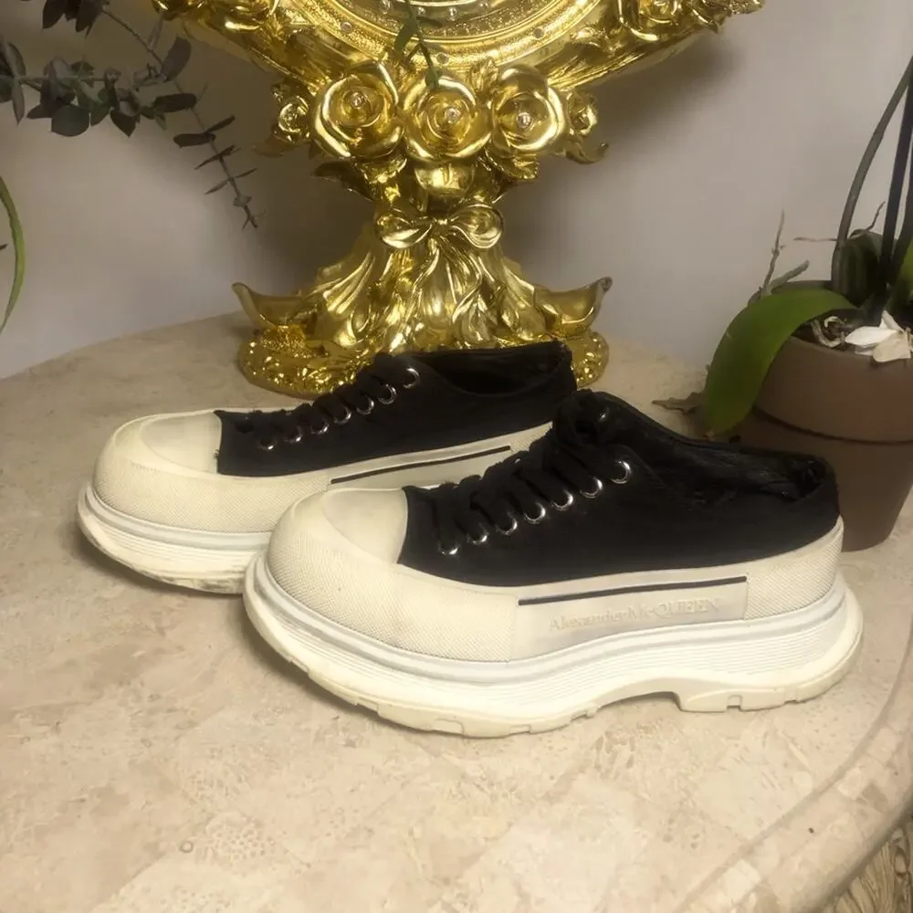 Alexander McQueen black and white platform chucks.