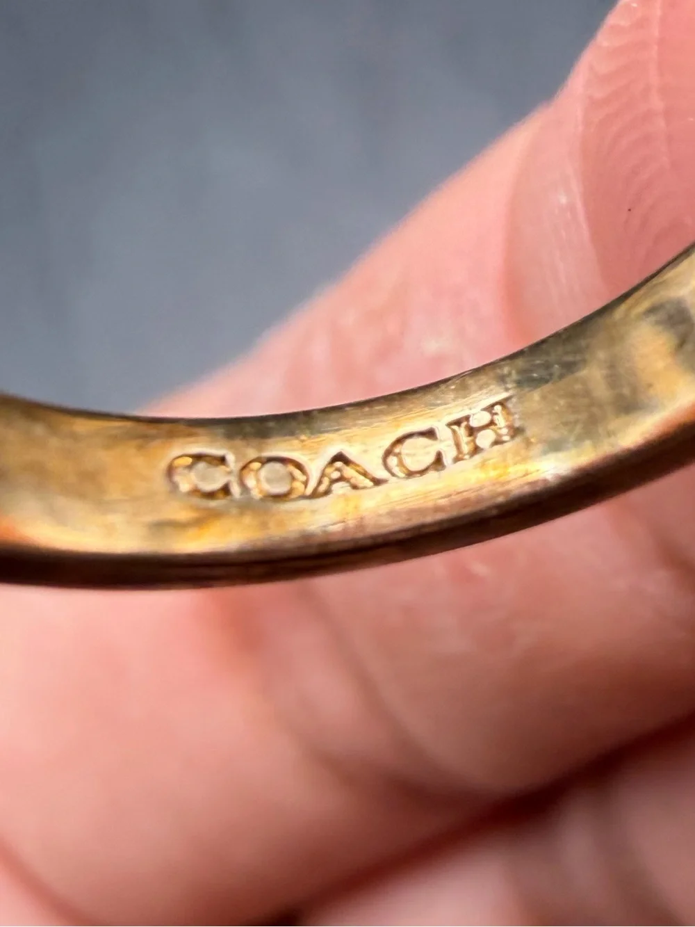 Coach gold tone