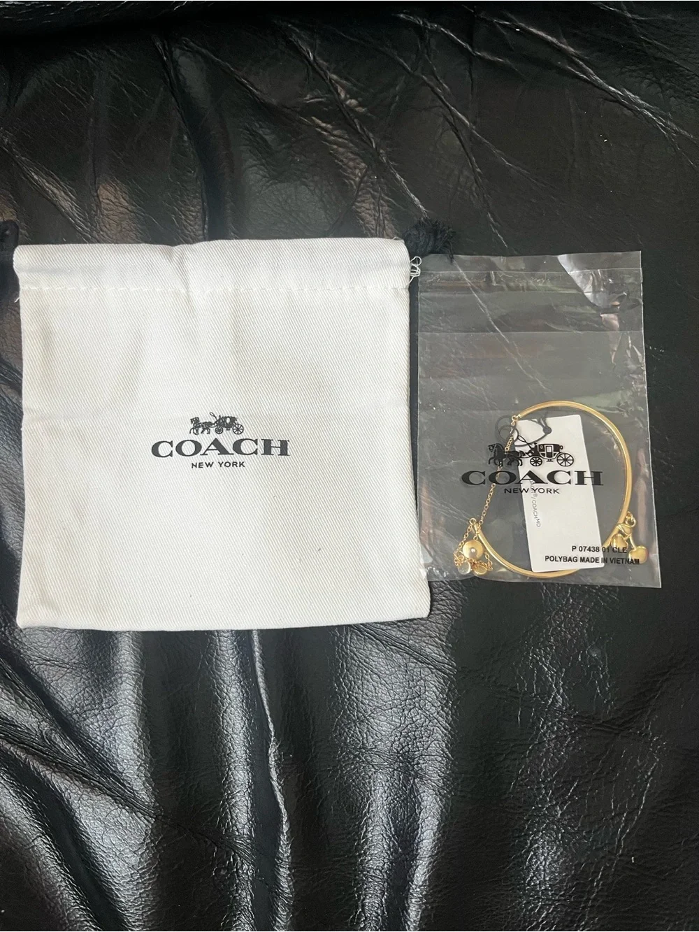 Coach gold tone