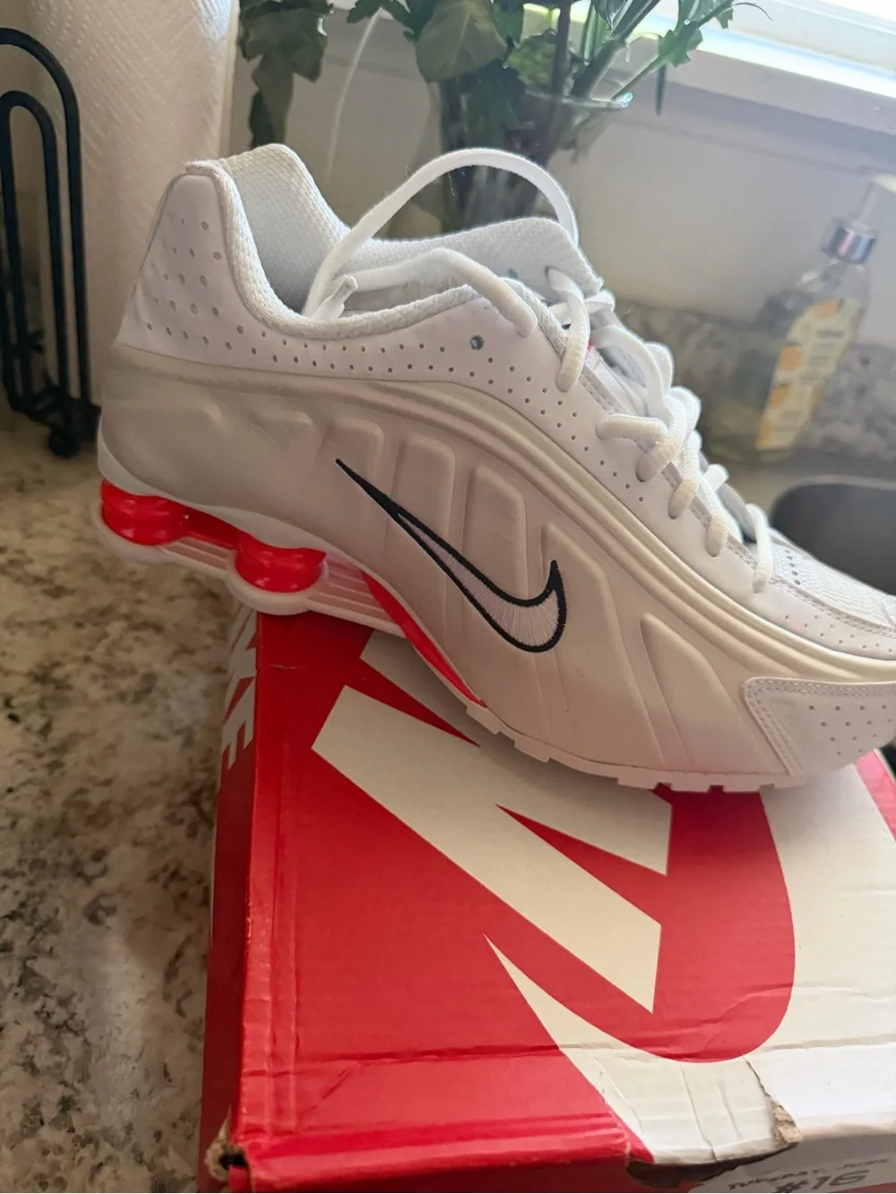 Nike White Sneakers with Black Swoosh and Red Sole Accents