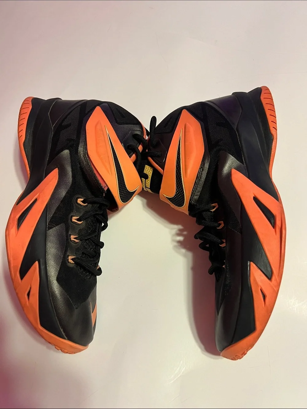 Nike gold prominent