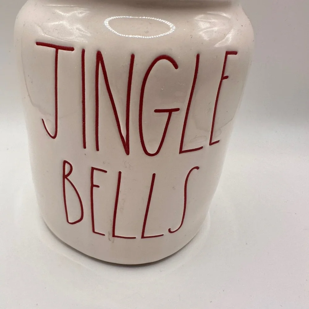 Rae Dunn Jingle Bells Christmas Canister with Santa Hat Lid Magenta Ceramic Jar