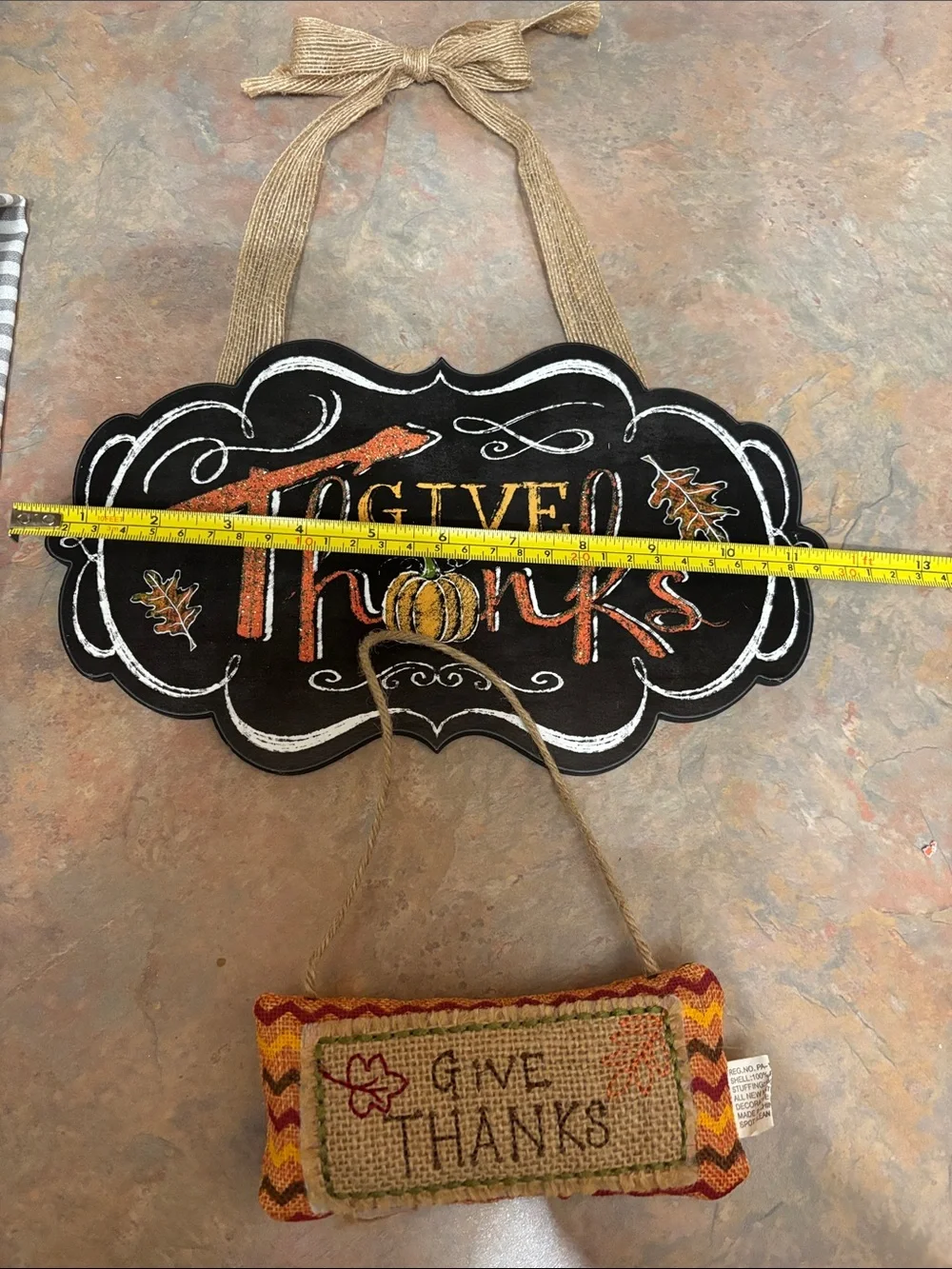 4 thanksgiving designed dish towels. 2 thanksgiving designed signage.