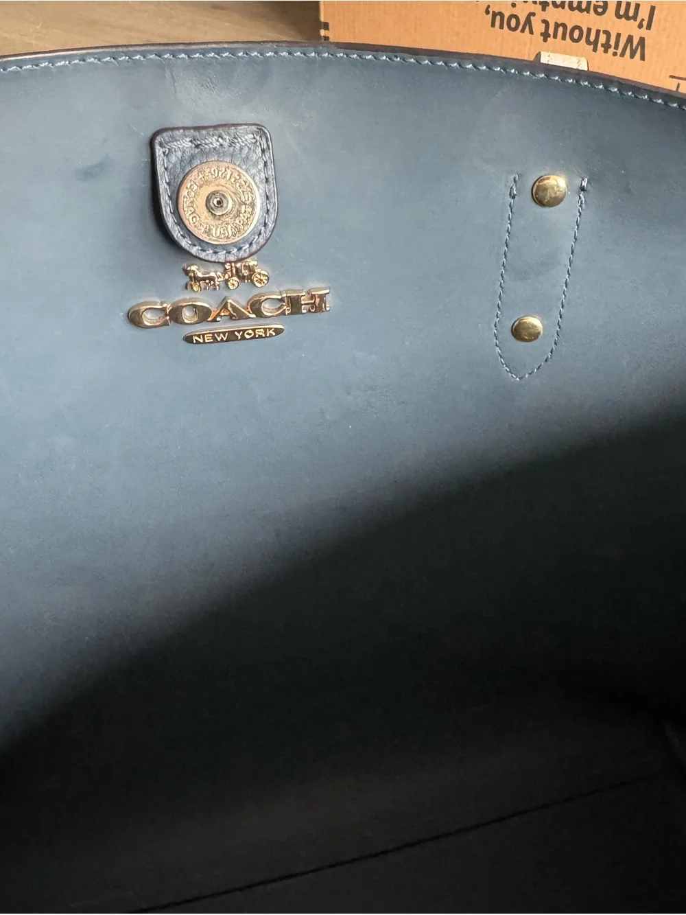 Coach tone leather gold