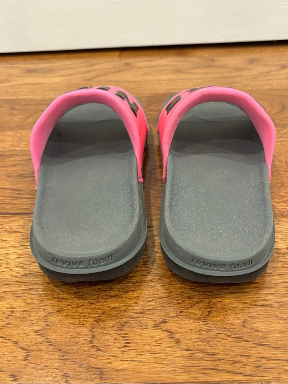 Nike Women’s Pink and Gray Slide Sandals with Bold Logo