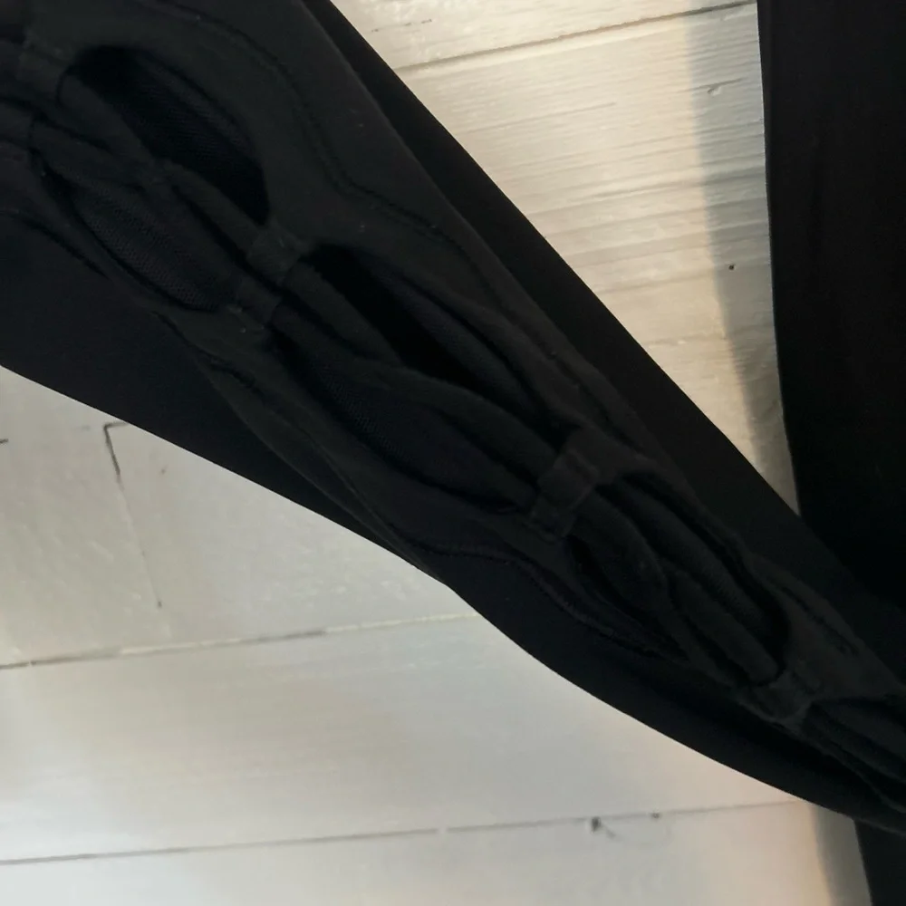 Lululemon Black Tied to It leggings.  Women's size 6, great condition!
