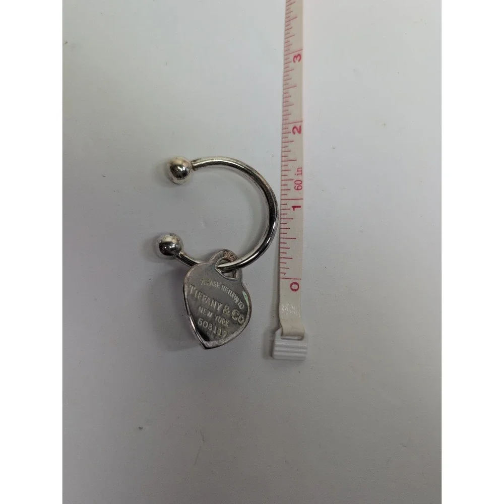 PLEASE RETURN TO TIFFANY & CO. 2001 HEART KEYCHAIN TWIST