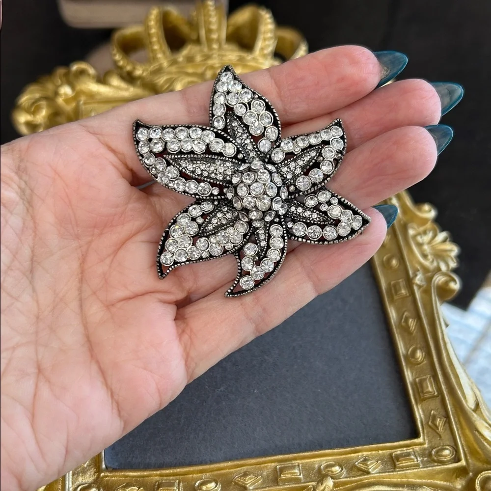 Elegant Black and Silver Floral Brooch