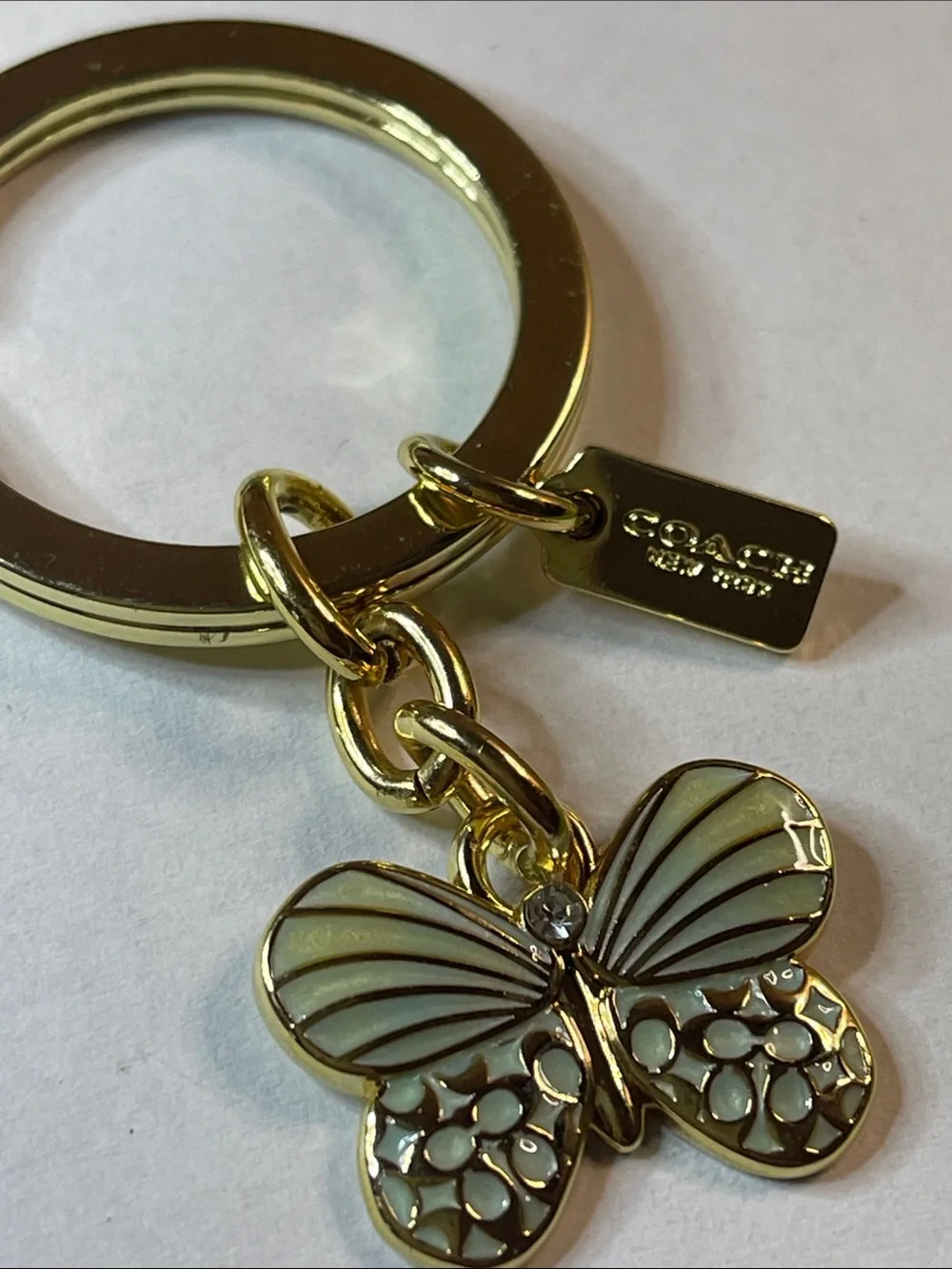 Coach gold tone