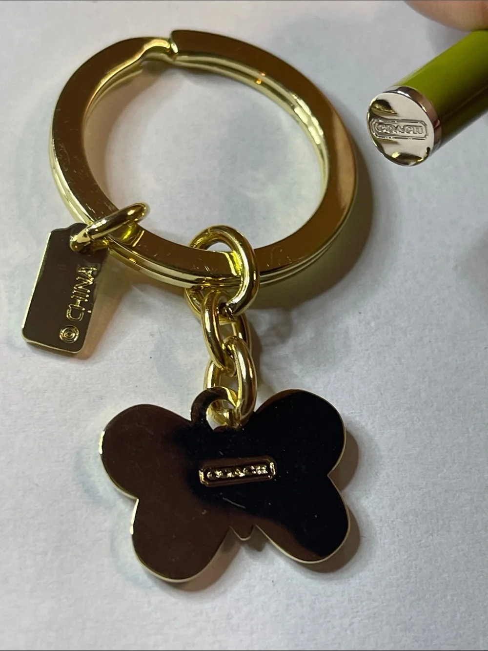 Coach gold tone