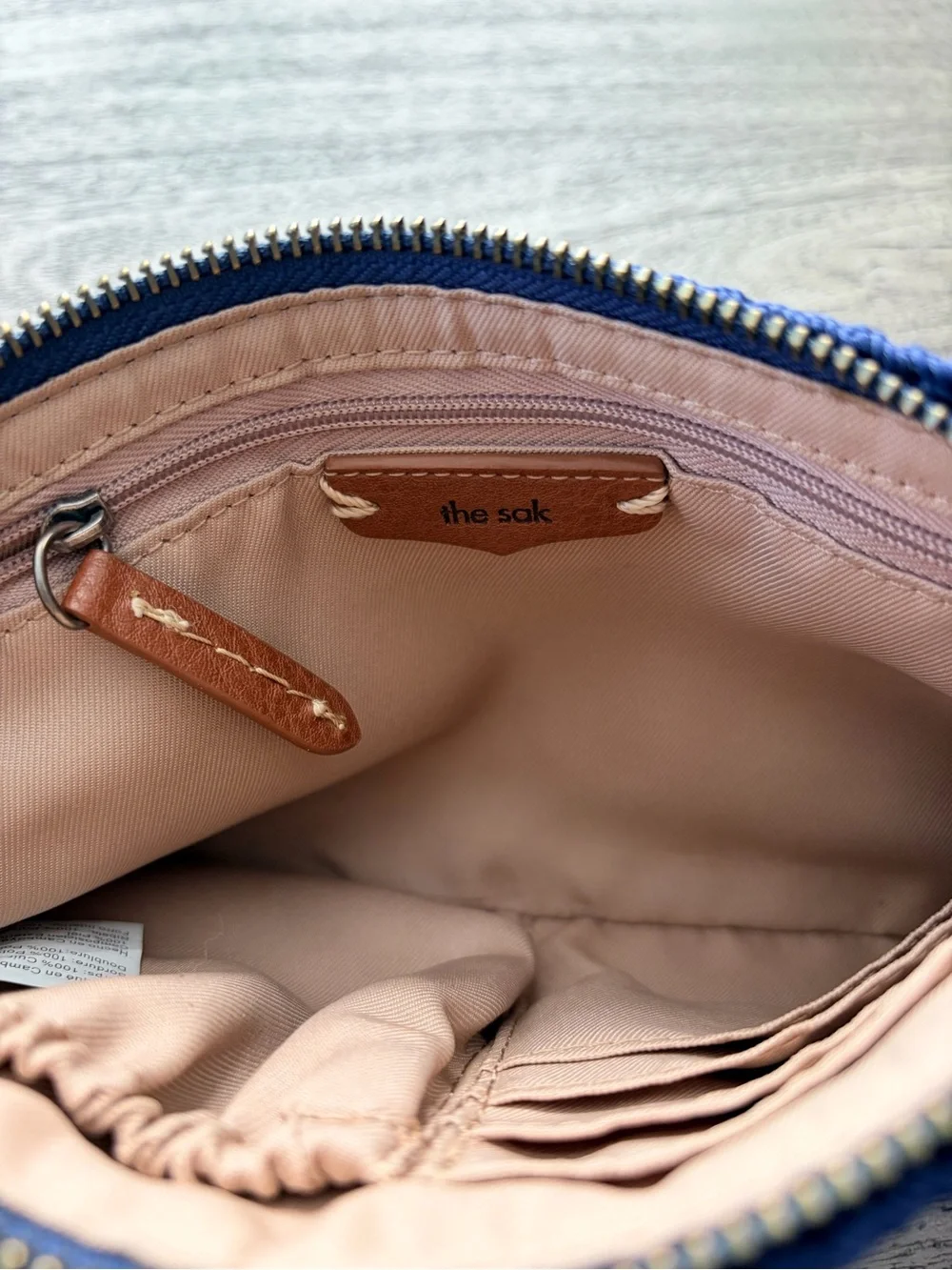 The Sak Vita Blue Leather Boho Wristlet with Crochet Trim EUC