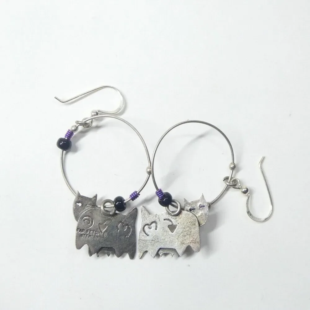 Far Fetched earrings featuring
