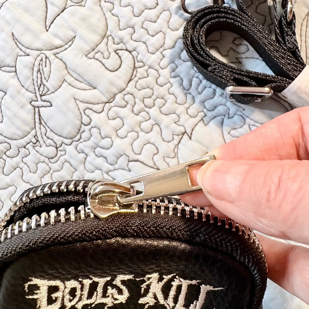 Dolls Kill compact edgy