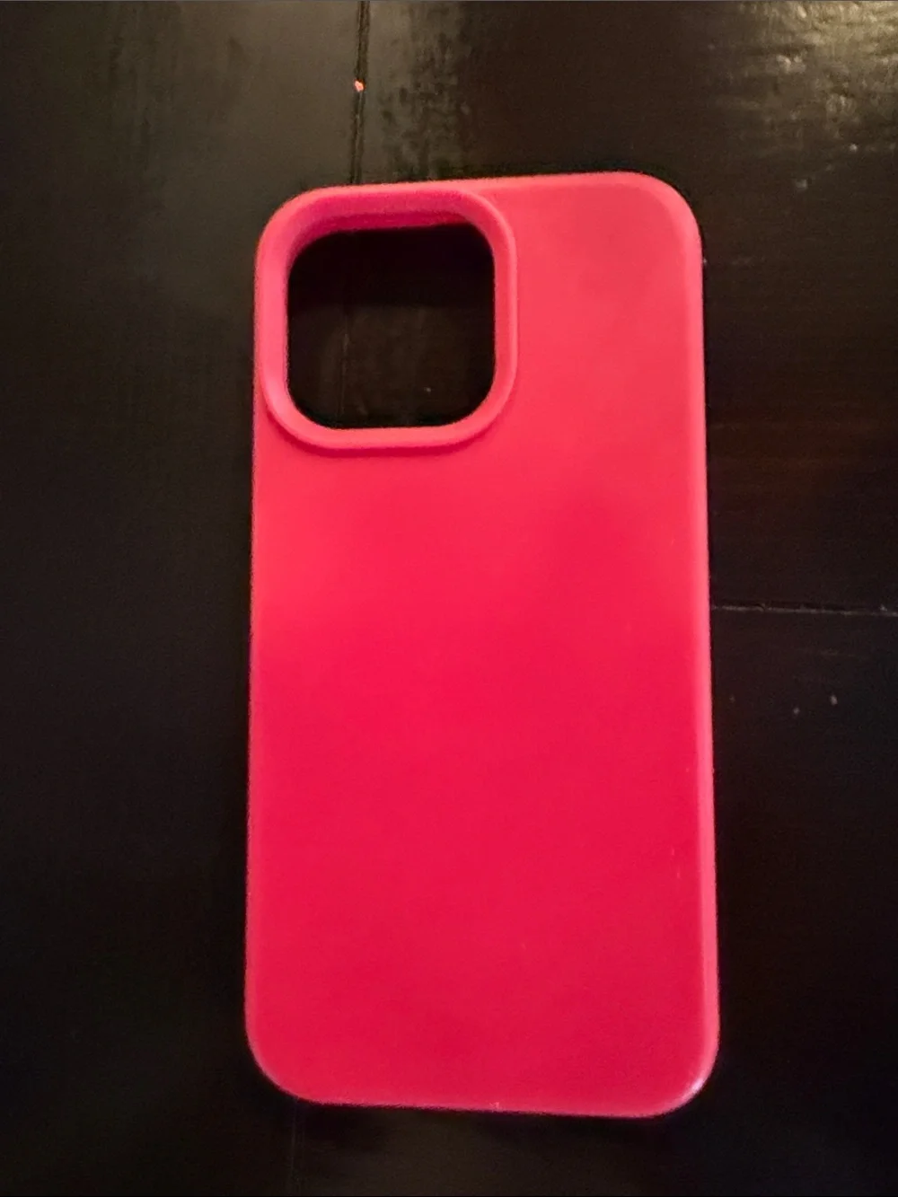 iPhone 15 Pro Max hot pink silicone phone case.
