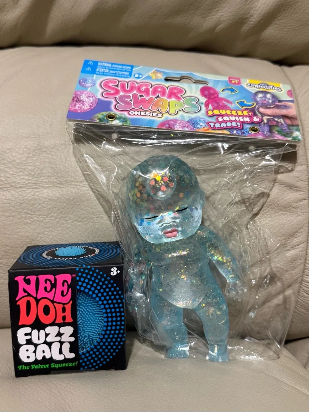 NeeDoh Blue Fuzz Ball Velvet Squeeze & ORB Toys Sugar Swaps Onsie Baby in Blue