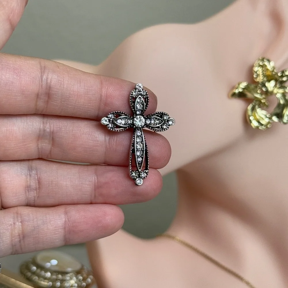 Anthropologie elegant cross